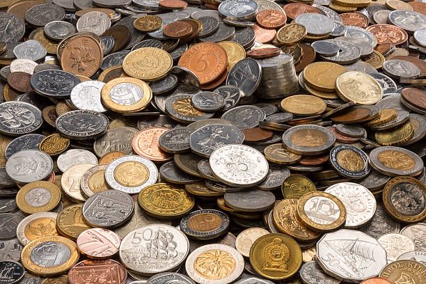 Collection of Old Coins Currency - A collection of old coins from around the world. coin collection stock pictures, royalty-free photos & images