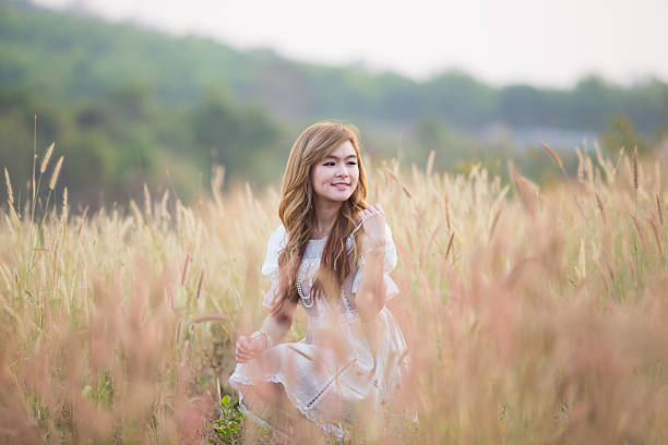 Happy girl relaxing on meadow
