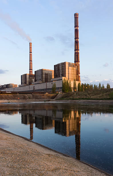 istock coal power plant with reflection at dusk, industrial landscape. 522466448