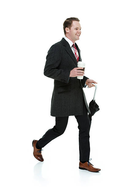 istock Smiling businessman walking 522466506