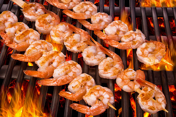 Delicious prawn spit on grill stock photo