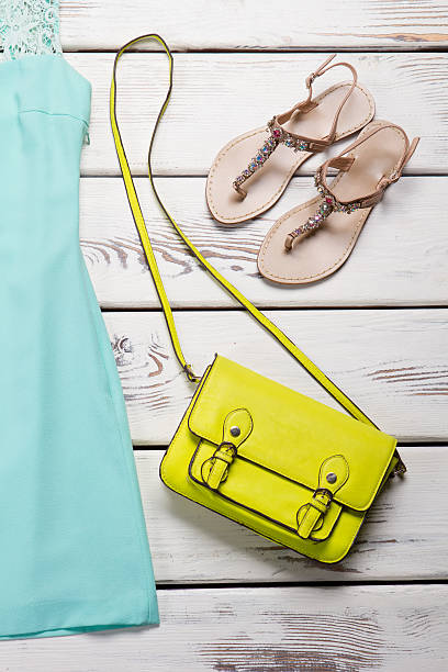 istock Lime purse and beige sandals. 522470852