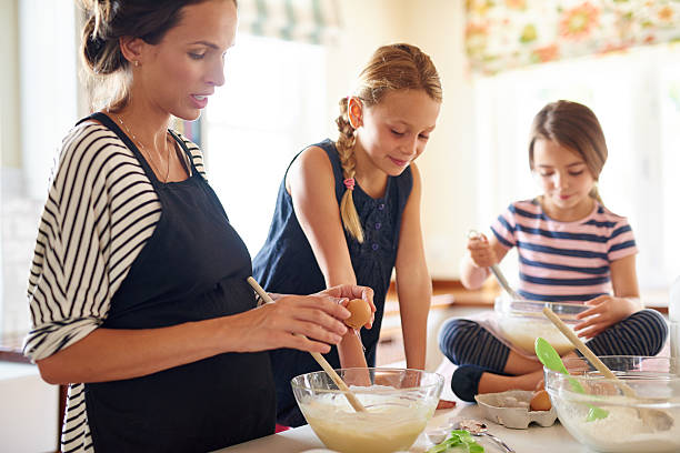 istock The love helping mom make treats 522470912