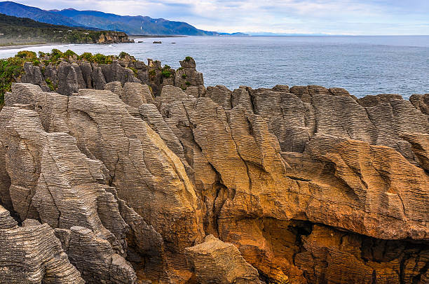 istock Pancake rocks in Punakaiki, New Zealand 522472448