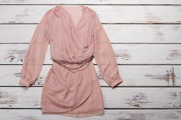 istock Peach dress with long sleeves. 522472618