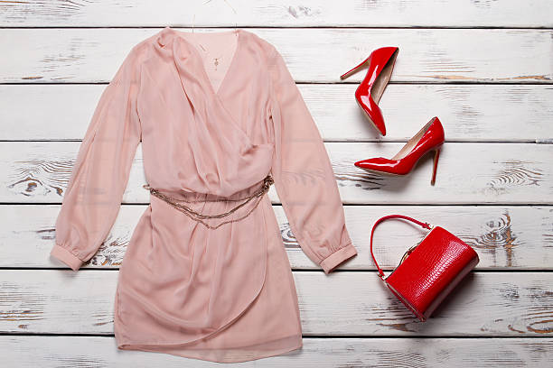 istock Peach dress with glossy heels. 522473048