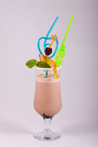 istock Milkshake in a glass decorated with berry, chocolate and mint 522473154