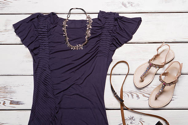 istock Purple t-shirt and necklace. 522473232