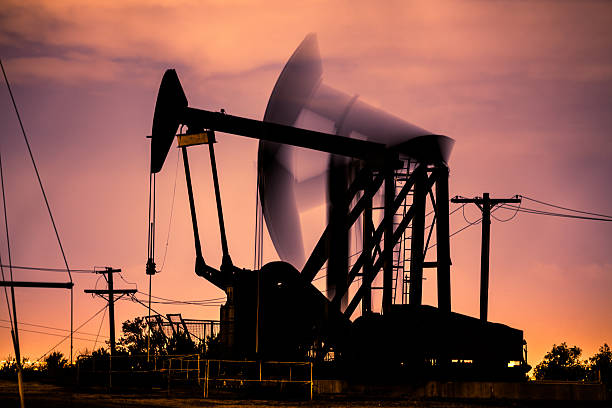 istock Oil Pumpjacks At Night In Los Angeles 522475250