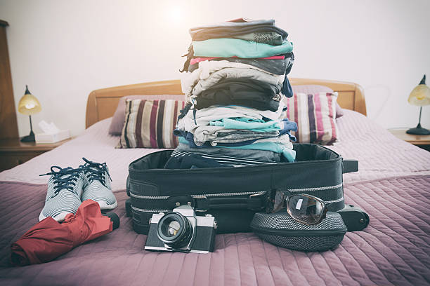 Teasing precedent make it flat Luggage With Clothes And Other Items Stock Photo - Download Image Now -  Suitcase, Bed - Furniture, Open - iStock