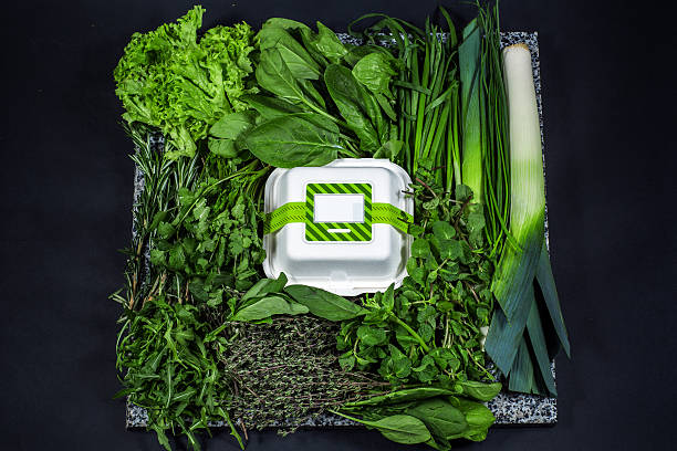 Various fresh greens with lettuce, mint, parsley, onion and box