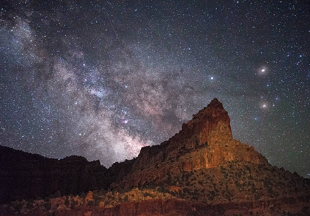 Eph Hanks Tower and Milky Way, UT Eph Hanks Tower, Capitol Reef NP, UT. At this time of year (April) the Milky Way core rise before dawn. This was taken at 3am and I used an LED fill to paint the mountain. capitol reef national park stock pictures, royalty-free photos & images