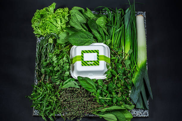 Various fresh greens with lettuce, mint, parsley, onion and box