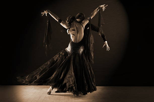 istock Dancers in ballroom at black background 522477928