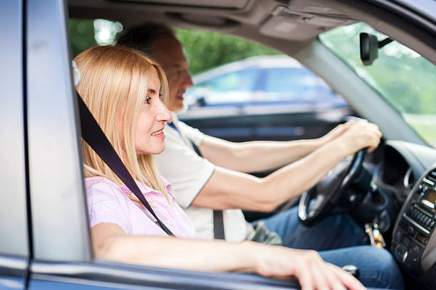 istock Mature couple traveling in their car 522478868