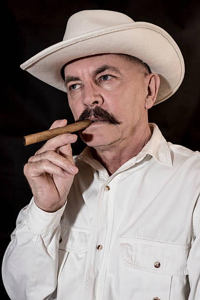 istock The cowboy with mustache in a white hat 522481596