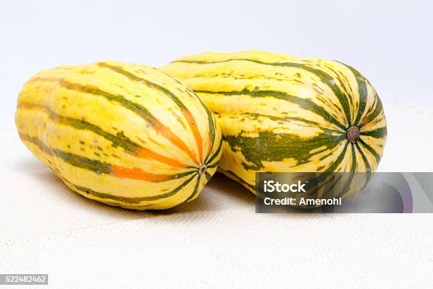 Two Delicata Squashes On White Tablecloth Stock Photo - Download Image Now - Squash - Vegetable, Cooking, Crop - Plant