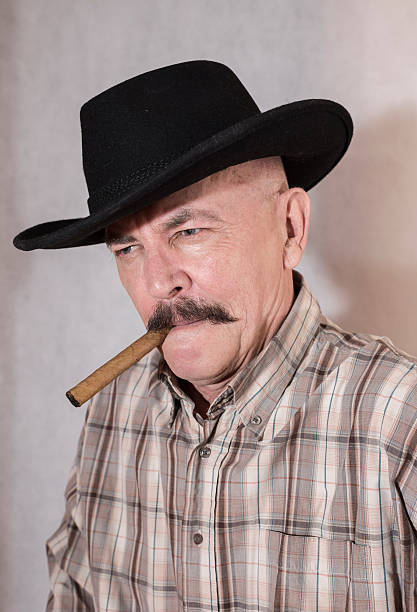 istock The cowboy with mustache, in a black ha 522482816