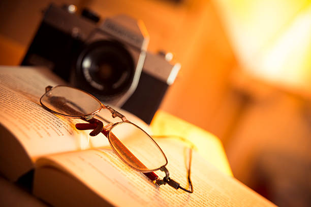 istock Glasses, book and film camera 522483177