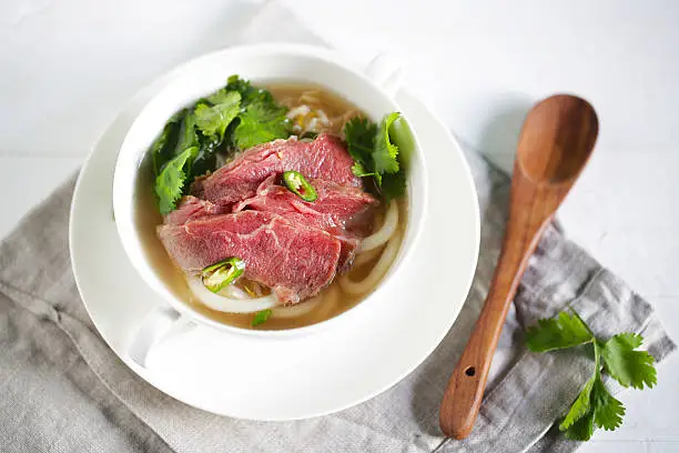 Photo of Beef udon noodle soup with brisket, pho from vietnam, coriander
