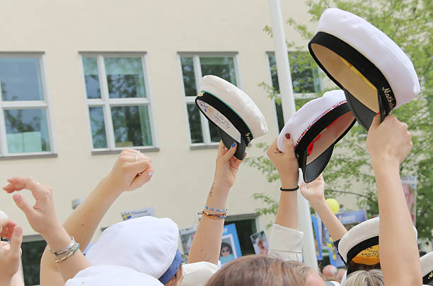 graduation caps, hands and arms of celebrating graduation studen - studenter sweden bildbanksfoton och bilder