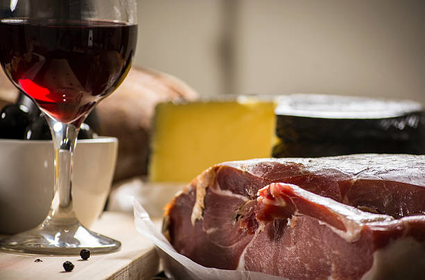 istock Parma ham, black olives, manchego cheese and bread table set 522483857