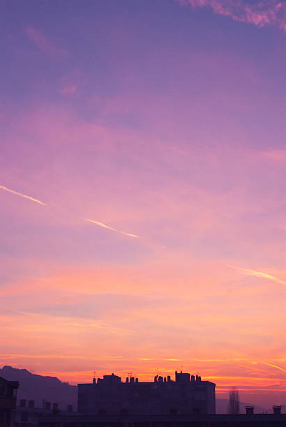 Beautiful blue and orange sky colors at sunshine over city landscape aerial view