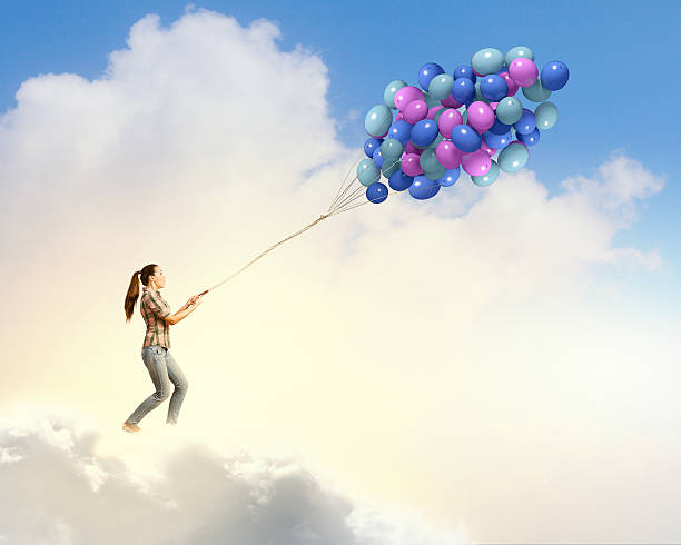istock Woman with balloons 522485971