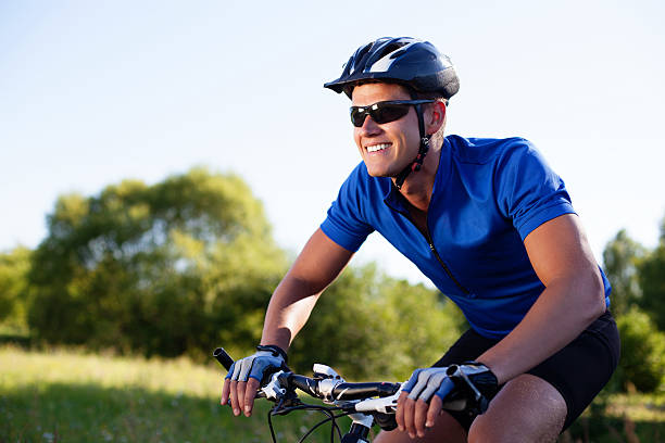 istock Mountain biker riding bike 522486959