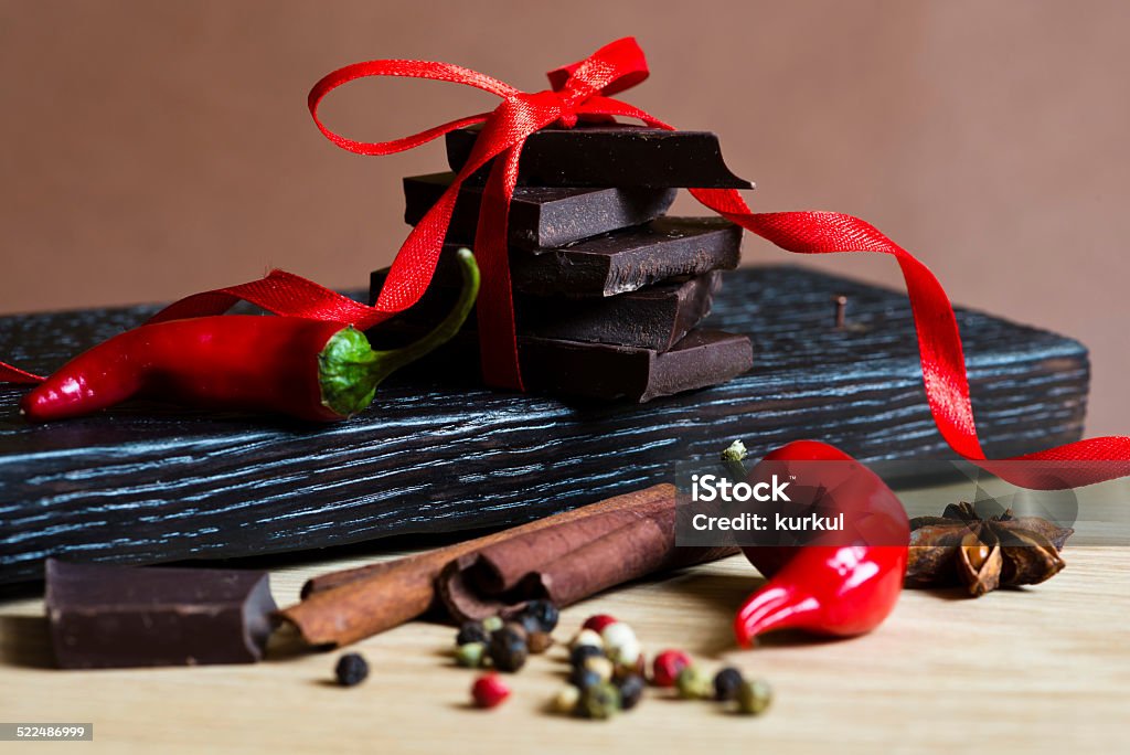 Chocolate Chocolate with spices on a wooden plate Anise Stock Photo