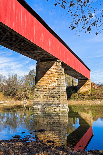 The Williams Covered Bridge spans the East Fork of the White River in rural Lawrence County, Indiana. The two span Howe truss design, built in 1884, is 373 feet long.