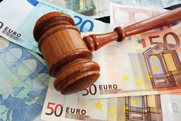 Court gavel over assorted Euro notes  - European Union concept
