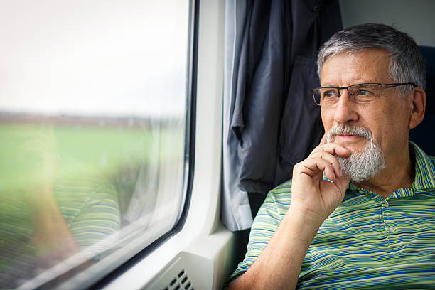 istock Senior man enjoying a train travel 522488501