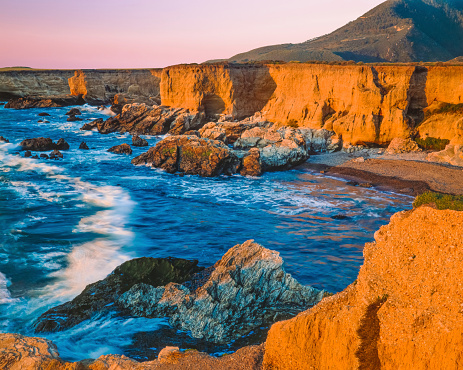 The last light of the day hits the Rocky Cliffs Of Montana De Oro State Park, CA