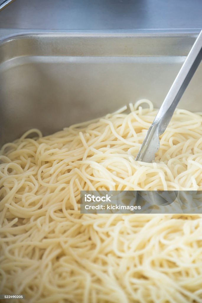 Boiled Spaghetti in Tray Close-up of boiled spaghetti noodles in tray. Asian Food Stock Photo