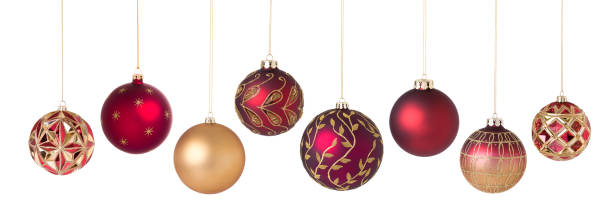 istock Christmas ornaments red gold in a row isolated on white 522490467