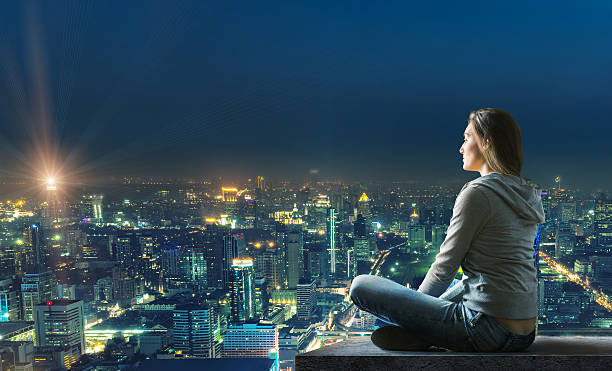 istock Woman is sitting over the city 522508005