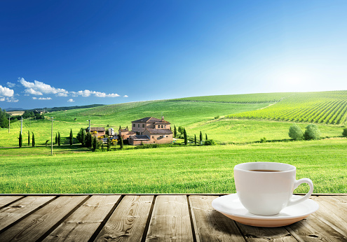 cup coffee and tuscany landscape, Italy