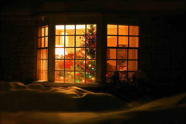 Welcome Home Christmas Tree in Window stock photo