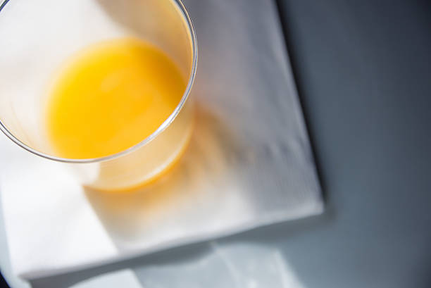 Close-up of airline orange juice in glass.