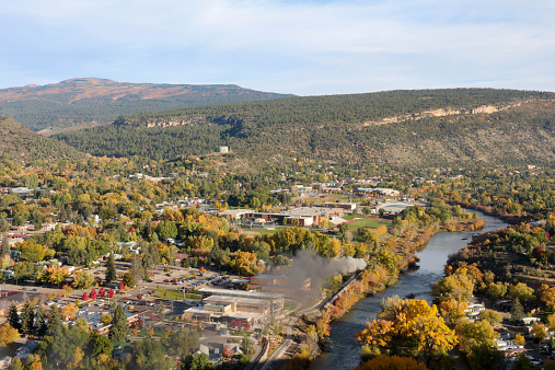 View of Durango from the Rim Trail.  Narrow gage railroad running next to the Animas River