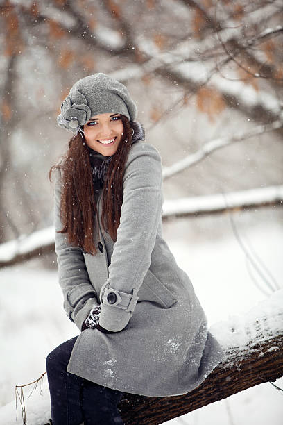 Girl in winter forest stock photo