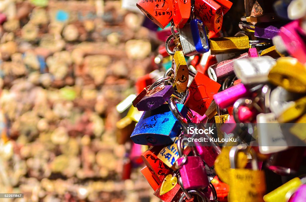 many colored locks of love many colored locks of love in the gate of the House of Romeo and Juliet in verona in Italy Arranging Stock Photo