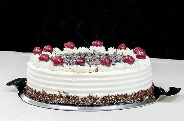 Photo of Cream cake with cherries