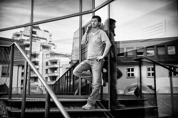 istock man talking on cellphone at modern office building 522513879