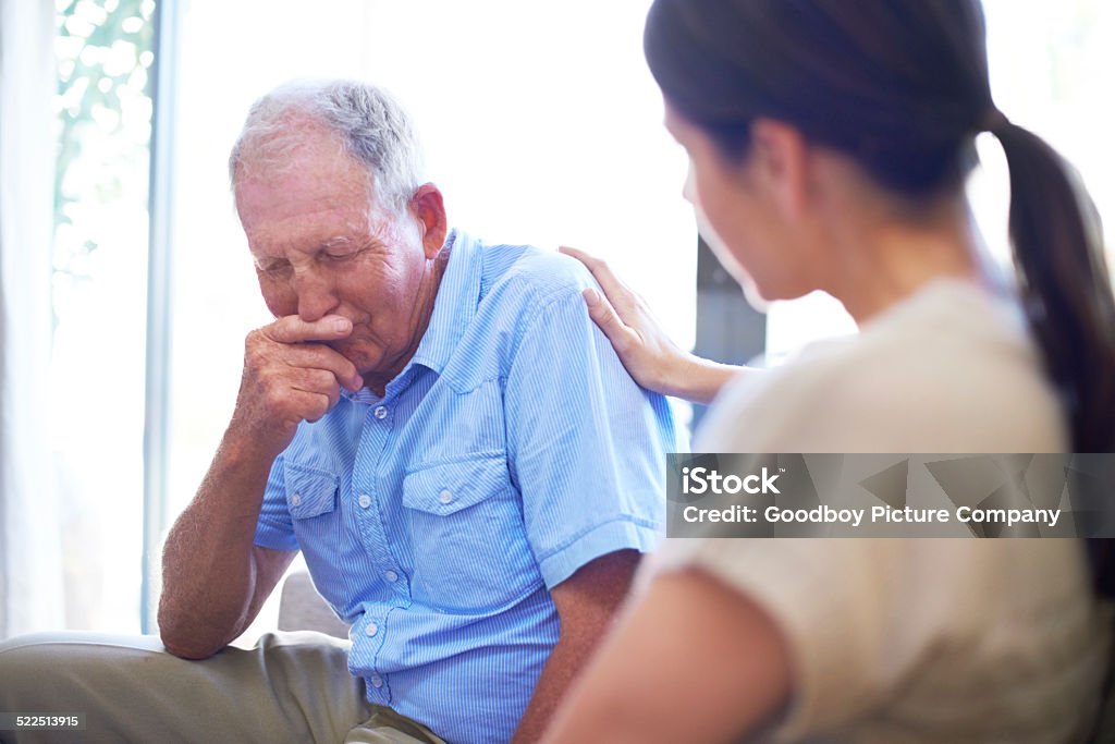 Coming to grips with loss A devastated senior man dealing with some terrible news Senior Adult Stock Photo