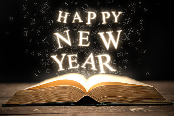 Happy New Year Glowing Letters Stock Photo - Download Image Now - Book, New  Year's Eve, New Year - iStock