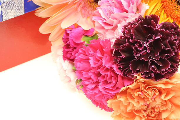 istock Bouquet of carnation and transvaal daisy with gift box 522514301