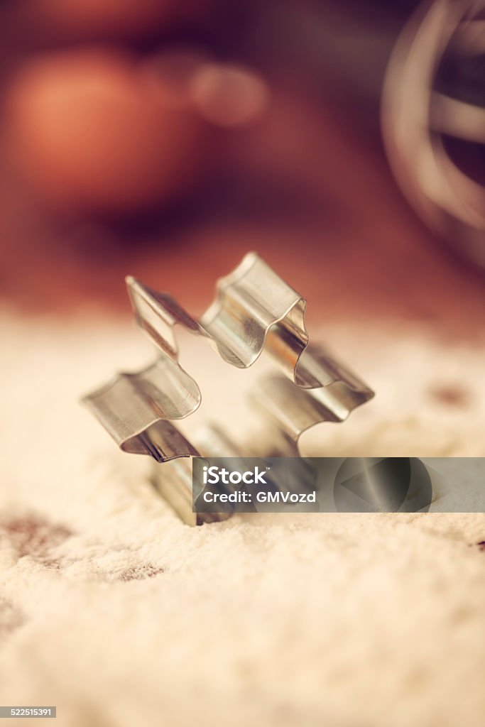 Christmas Cookie Cutter Starshaped Christmas cookie cutter on kitchen desk ready to bake and make cookies. Baking Stock Photo