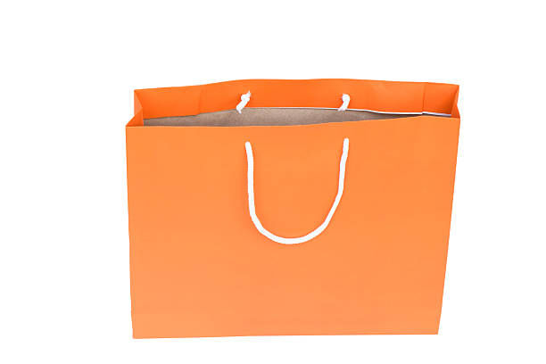istock Orange shopping bag isolated with clipping path 522515775
